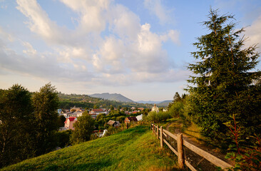 Fototapeta na wymiar Summer village. Beautiful mountains landscape with green valley.