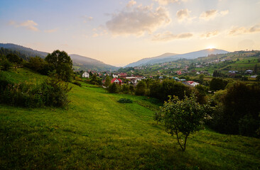 Summer village. Beautiful mountains landscape with green valley.