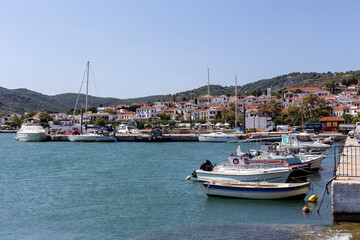 Fototapeta na wymiar In the embankment of the island of Skopelos (Northern Sporades, Greece) on a summer day