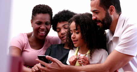 Happy family looking smartphone device