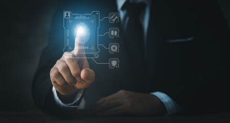Businessman wearing a suit pointing to a hologram, hologram icon fingerprint encryption, protecting access to confidential information by using fingerprint technology. Fingerprint encryption concept.