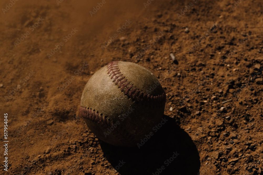 Sticker used ball from baseball game in dirt on ground close up for sport. - Stickers