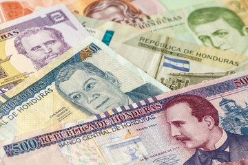 Obraz premium Honduras money, paper banknotes, Creative currency business, banking and finance, 500 and 200 Lempiras banknote, Other denominations in the background