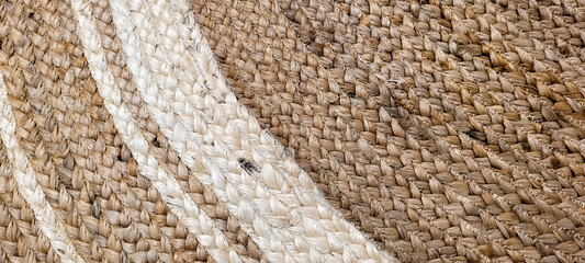 handmade straw rug with white details