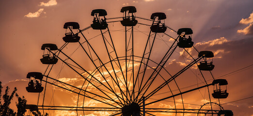 carousel wheel at sunset