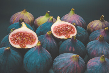 Tasty figs on a black background. Top view.