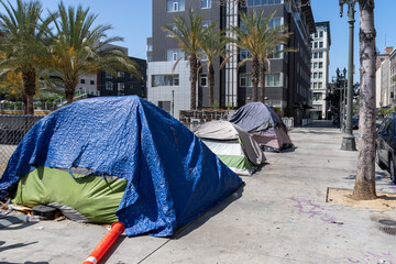 Homeless tents along the roadside in downtown Los Angeles, California, USA. 