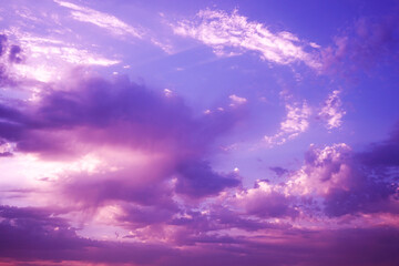 Beautiful purple pink evening sky with clouds view. Colorful sunset background with space for design. Romantic.