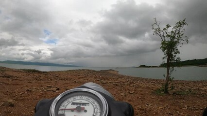 clouds over the riverbank