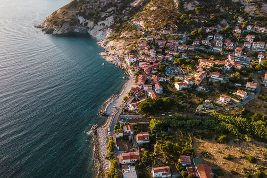 Aerial view of Pomonte, a small town along the coast facing the Mediterranean Sea, Elba Island, Tuscany, Italy.