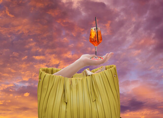 female hand hands glass of alcoholic aperitif