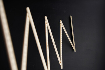folded ruler against chalkboard