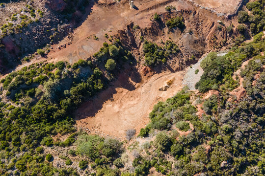 Aerial view of Laghetto Rosso, an open air mines on the hill in Rio, Elba Island, Tuscany, Italy.
