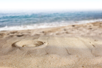 Fototapeta na wymiar Beach sand with sun shadows and an open space on a lovely hot holiday day