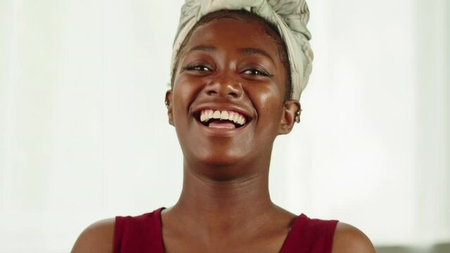 Happy native African woman portrait. Young female student laughing close-up. Model posing, looking at camera with wide smile. 