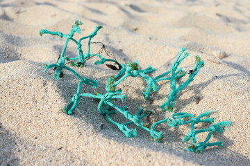Fototapeta na wymiar Green fishing net on the sand