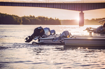Naklejka premium Motor boats on the river. Sport and recreation concept