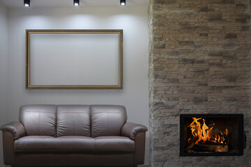 Conceptual composite image of a luxury apartment with sofa and fireplace and large empty picture frame for your artwork visualisation (not real property).