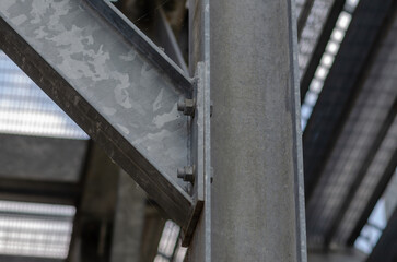 beam architecture: detail of a structure built with steel beams joined with bolting to support a...