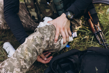 providing first aid for a leg injury
