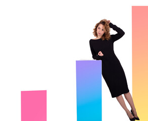 Fototapeta premium Beautiful business woman in black dress near coloured charts on the white background