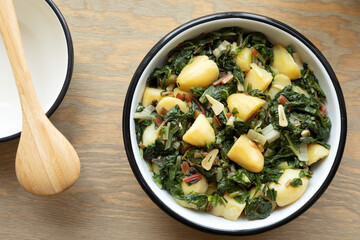 Blitva traditional homestyle south Croatia dish made with boiled potatoes, swiss chard, garlic and olive oil. - obrazy, fototapety, plakaty