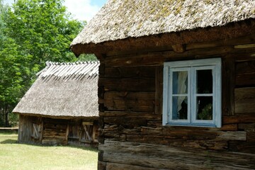 Fototapeta na wymiar Scenery of wooden cottages in Kashubian countryside, Wdzydze Kiszewskie, Poland