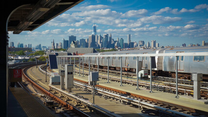 Train station platform with Manhattan skyline