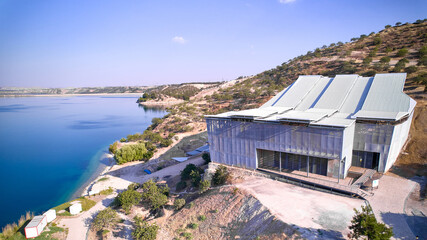 Aerial view Zeugma archeological excavation site, Birecik dam and water reservoir on Euphrates river. Belkis, Gaziantep province, Turkiye