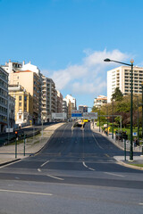 Fototapeta na wymiar Lisboa, Portugal. April 10, 2022: Joaquim Antonio de Aguiar street and blue sky in the city.