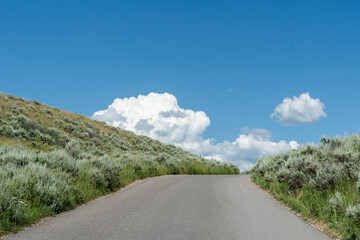 Fototapeta premium Cresting the hill after travelling up a winding road.