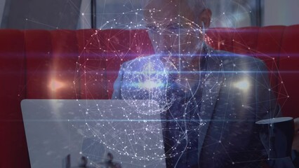 Globe of network of connections over caucasian senior businessman drinking coffee and using a laptop - Powered by Adobe