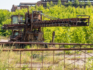 Rusted industrial iron structure. Abandoned industrial facility concept. Bankrupt and unused...