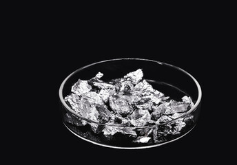 Chromium fragments, industrial use ore, metallic chemical element, isolated on black background...