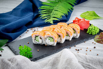 Sushi rolls filadelfia with cucumber. Traditional Japanese cuisine - obrazy, fototapety, plakaty
