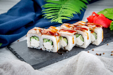 Sushi rolls with shrimp, cream cheese, unagi and tiger prawns. Traditional Japanese cuisine