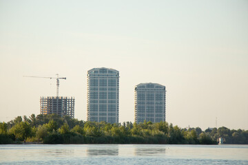 Cityscape on the banks of the Dnieper River, skyscrapers on the banks of the river in Ukraine 2022