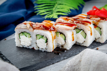 Sushi rolls with shrimp, cream cheese, unagi and tiger prawns. Traditional Japanese cuisine