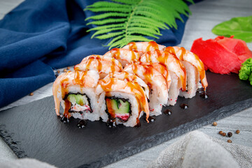 Sushi rolls with shrimp, cream cheese, unagi and tiger prawns. Traditional Japanese cuisine