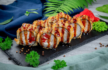 Fried tempura sushi rolls with chicken, cream cheese, smoked chicken, tomato and bell peppers....