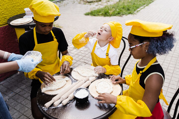 Childhood cook activity of multinational children of black african and caucasian kids. Happy...