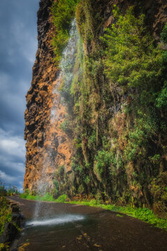 Cascata dos Anjos, Angels Waterfall, located in the civil parish of Anjos, municipality of Ponta do Sol, the water cascades directly onto the coastal road. Madeira, Portugal. October 2021