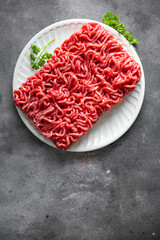 minced meat raw pork, beef, lamb cuisine fresh meal food snack on the table copy space food background rustic 