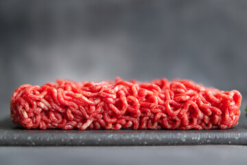 minced meat raw pork, beef, lamb cuisine fresh meal food snack on the table copy space food background rustic 