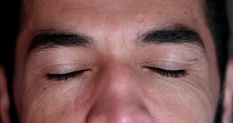 Man closing eyes in meditation. Contemplative person eyes closed