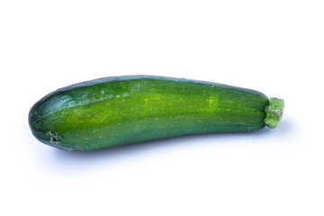 green zucchini lies on a white background