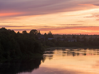 Evening sunset over the Onega River of the Arkhangelsk region in Russia. the concept of travel and...
