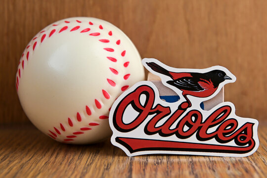 July 19, 2022, Cooperstown, New York. Baltimore Orioles Baseball Club Emblem And Baseball.