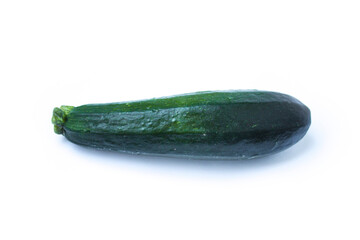 green zucchini lies on a white background
