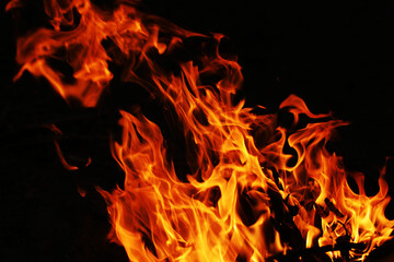Fire creates infinity shapes when it burns. The orange from the flame and the black backgroud creates interesting textures. Flames from hell. Burning power.